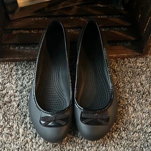 Black CROCS flats